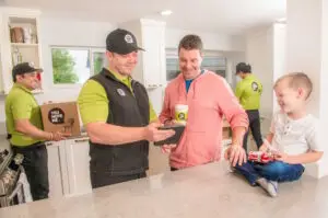 family talking to happy movers