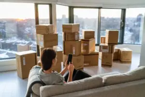 woman packed up calling moving company
