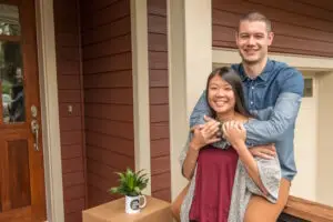 happy couple next to moving boxes