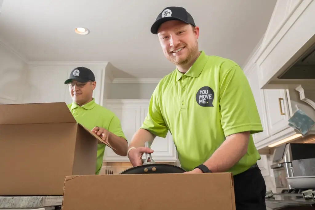 friendly movers packing kitchen