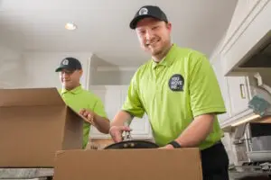 friendly movers packing kitchen