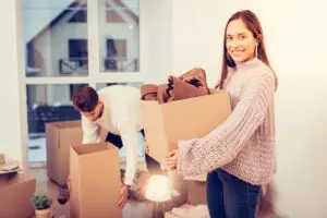 woman holding moving boxes