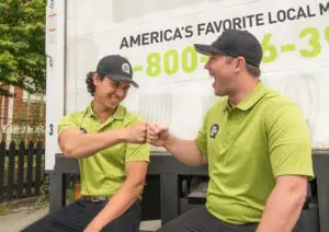 You Move Me movers fist bumping