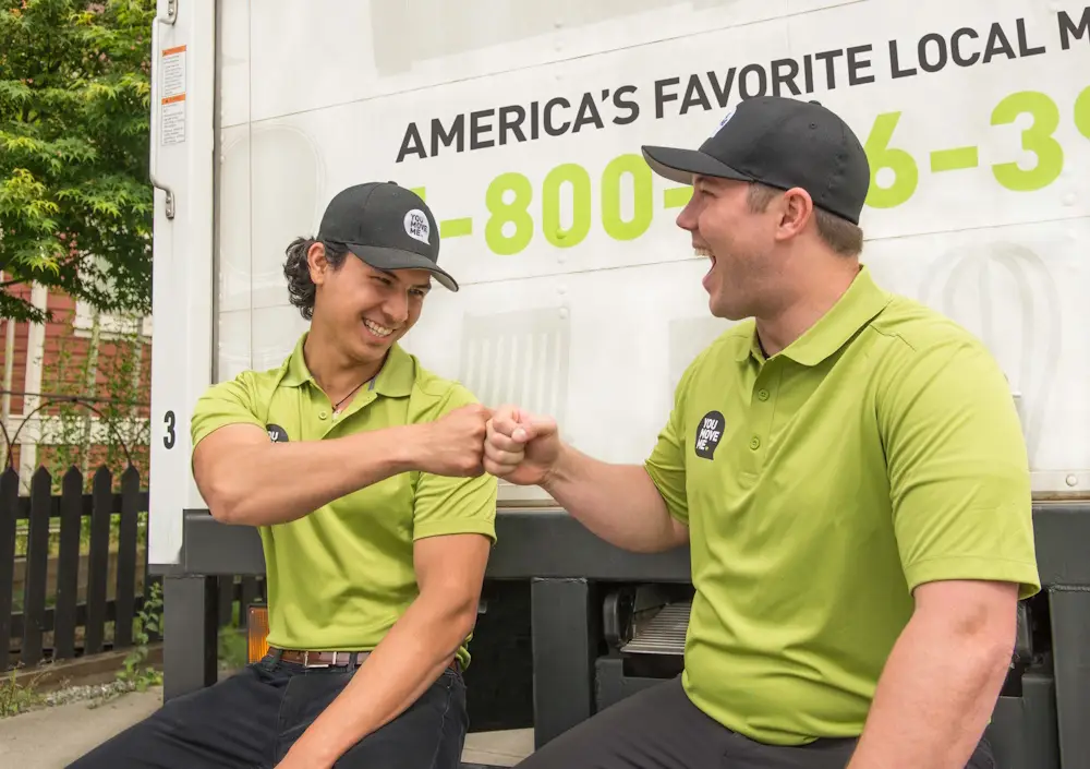 You Move Me movers fist bumping