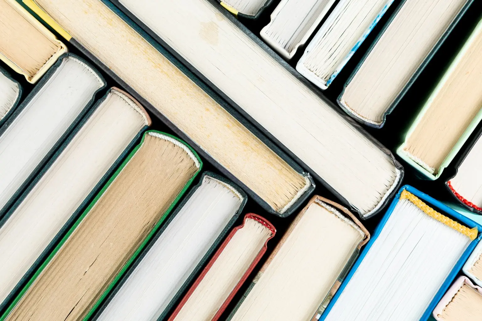 Top view of book spines and pages showing the parts most vulnerable to damage during a move